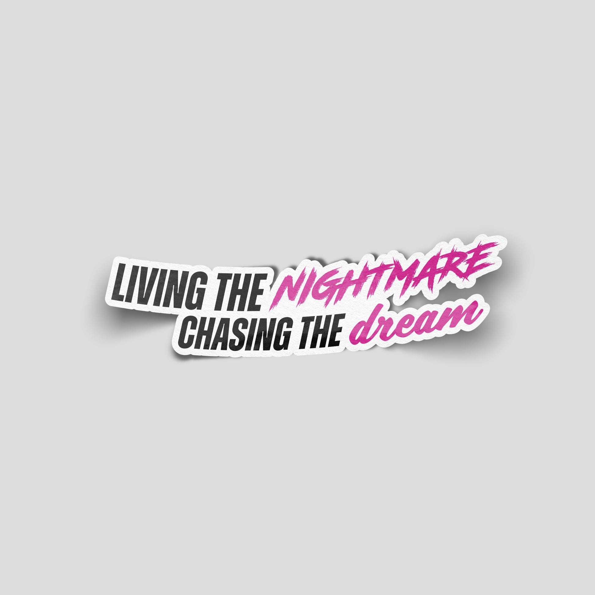 Living the nightmare chasing the dream slogan funny car sticker in black and pink text, UK car culture vinyl by Blum Decals