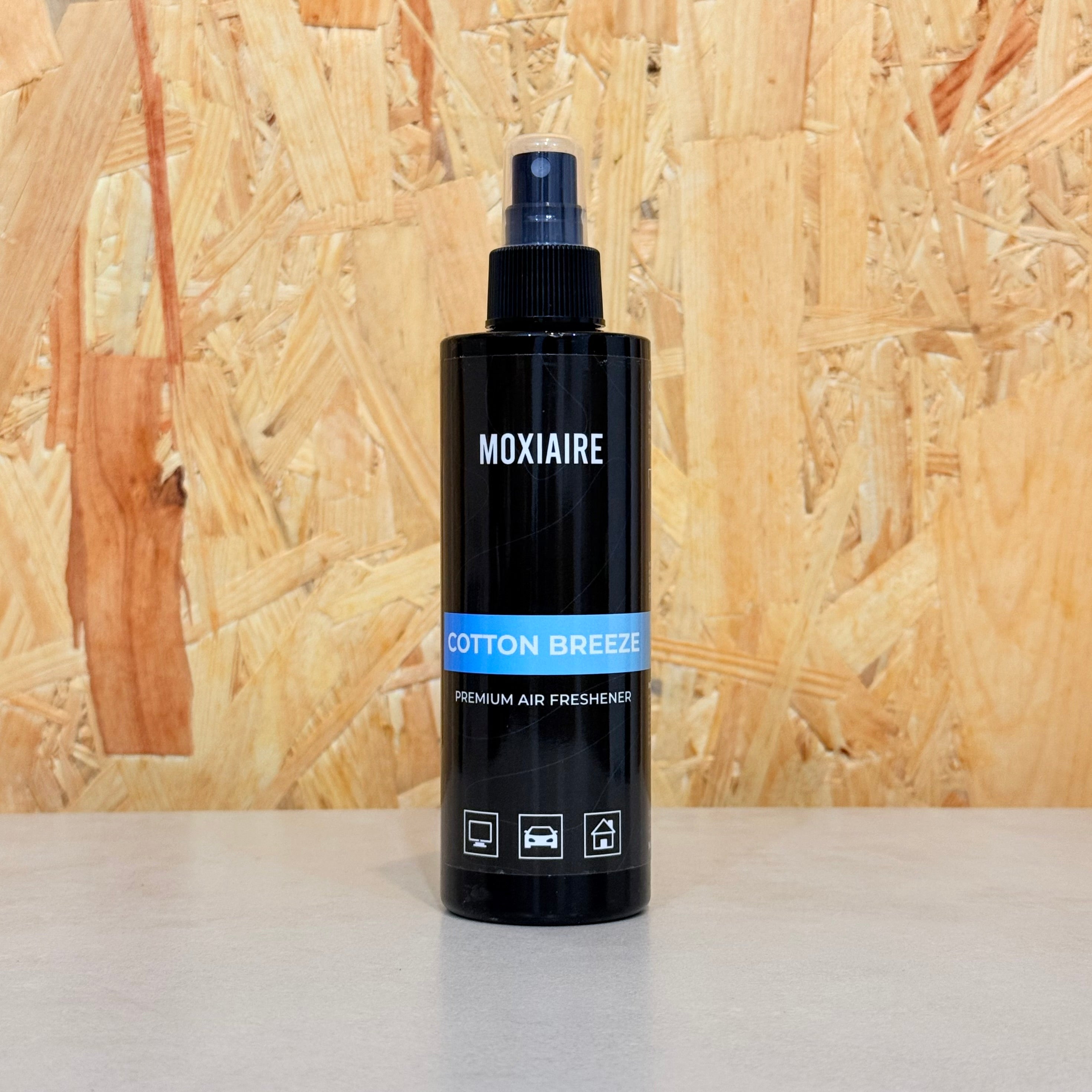 Moxiaire Cotton Breeze Premium Spray Air Freshener bottle on neutral background