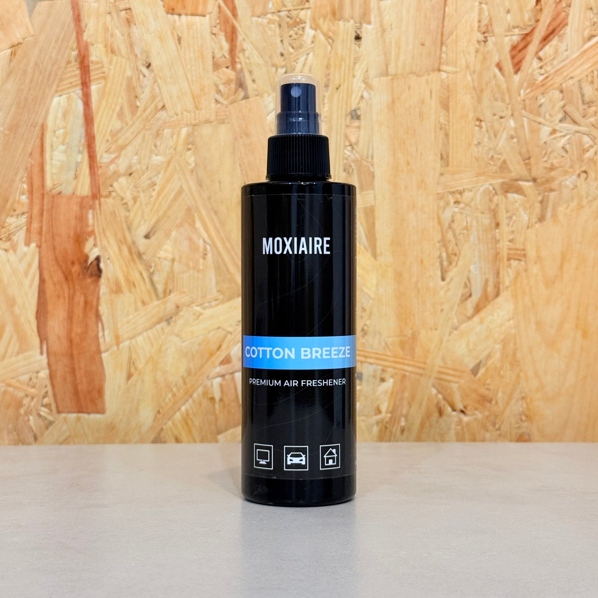 Moxiaire Cotton Breeze Premium Spray Air Freshener bottle on neutral background