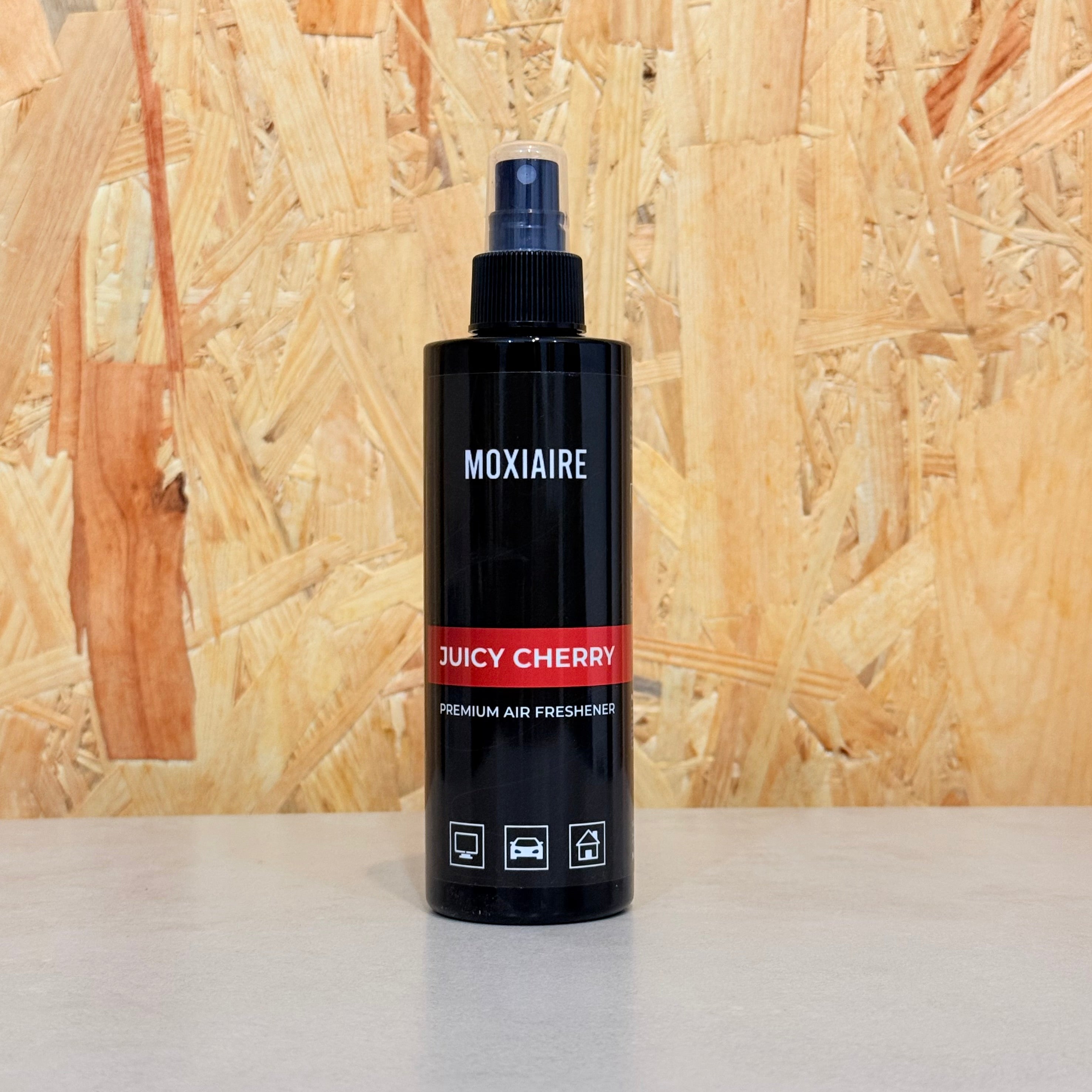 Moxiaire Juicy Cherry Premium Spray Air Freshener bottle on neutral background