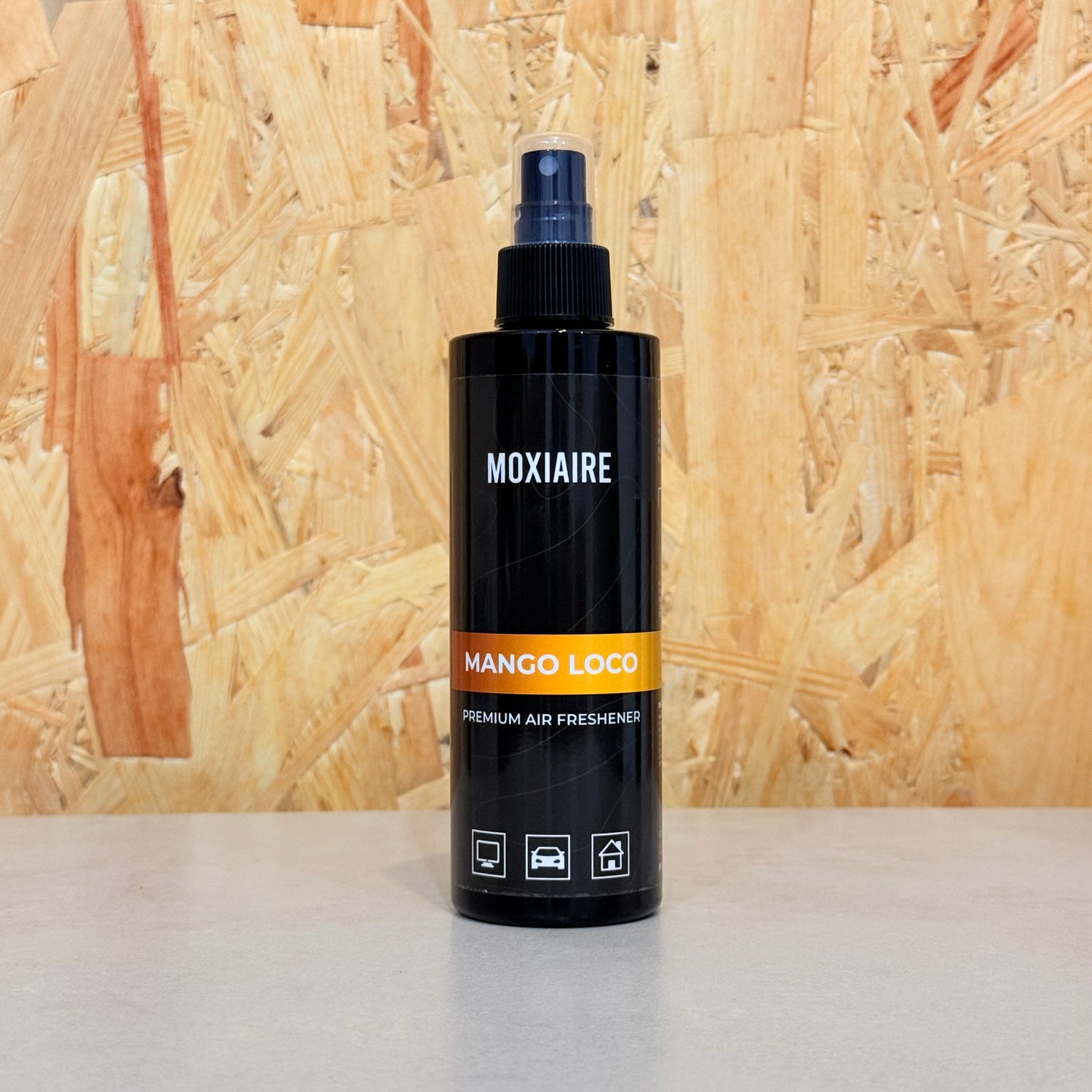 Moxiaire Mango Loco Premium Spray Air Freshener bottle on neutral background