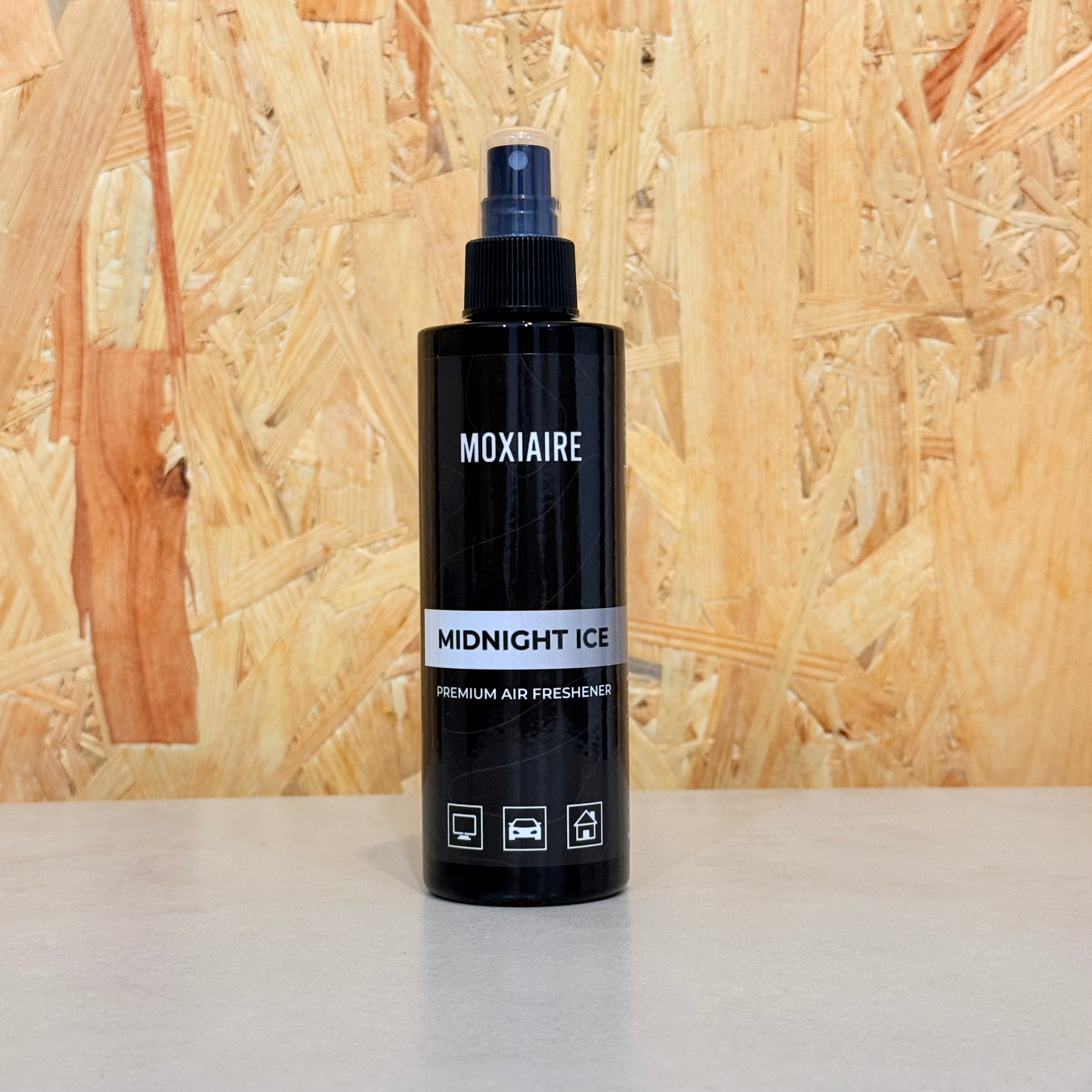 Moxiaire Midnight Ice Premium Spray Air Freshener bottle on neutral background