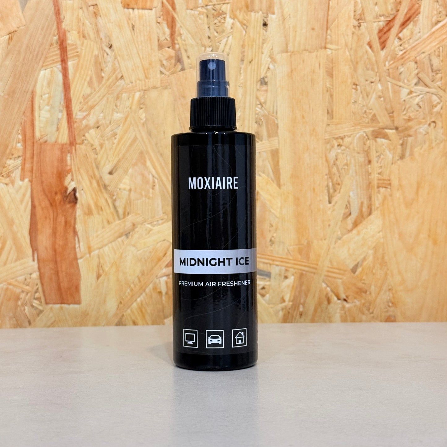Moxiaire Midnight Ice Premium Spray Air Freshener bottle on neutral background