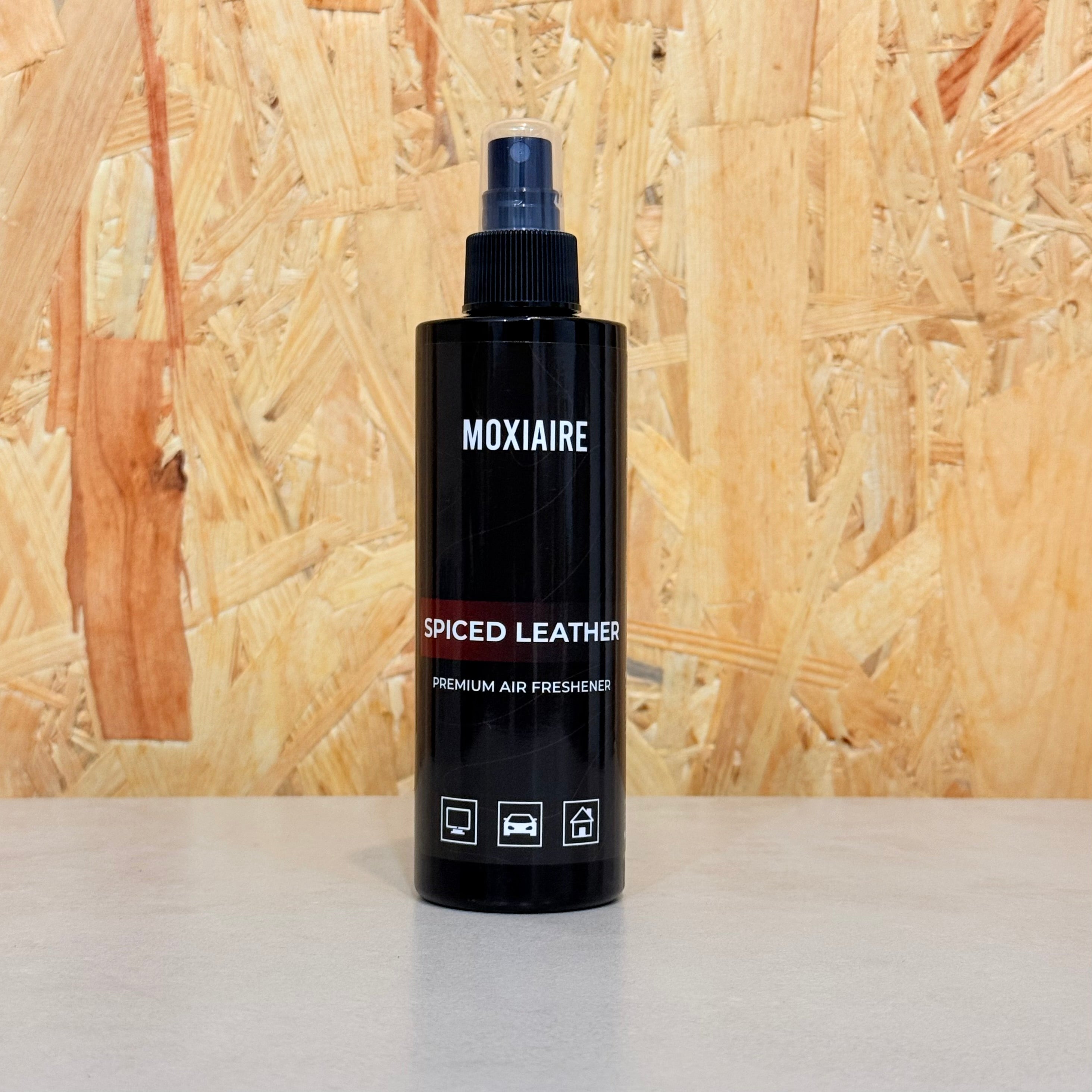 Moxiaire Spiced Leather Premium Spray Air Freshener bottle on neutral background
