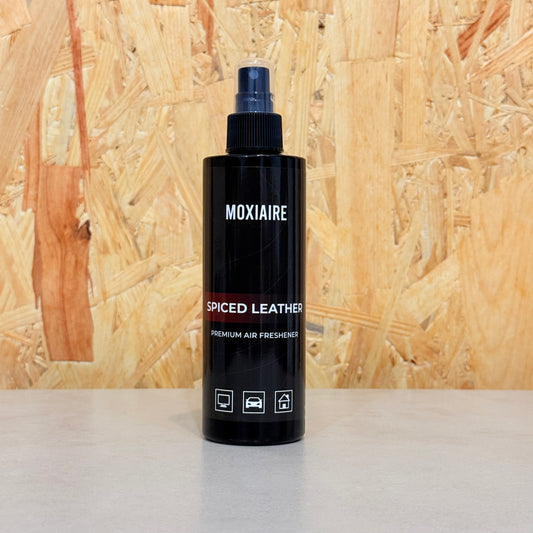 Moxiaire Spiced Leather Premium Spray Air Freshener bottle on neutral background