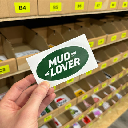 Funny off road sticker reading “mud lover” in green oval badge style