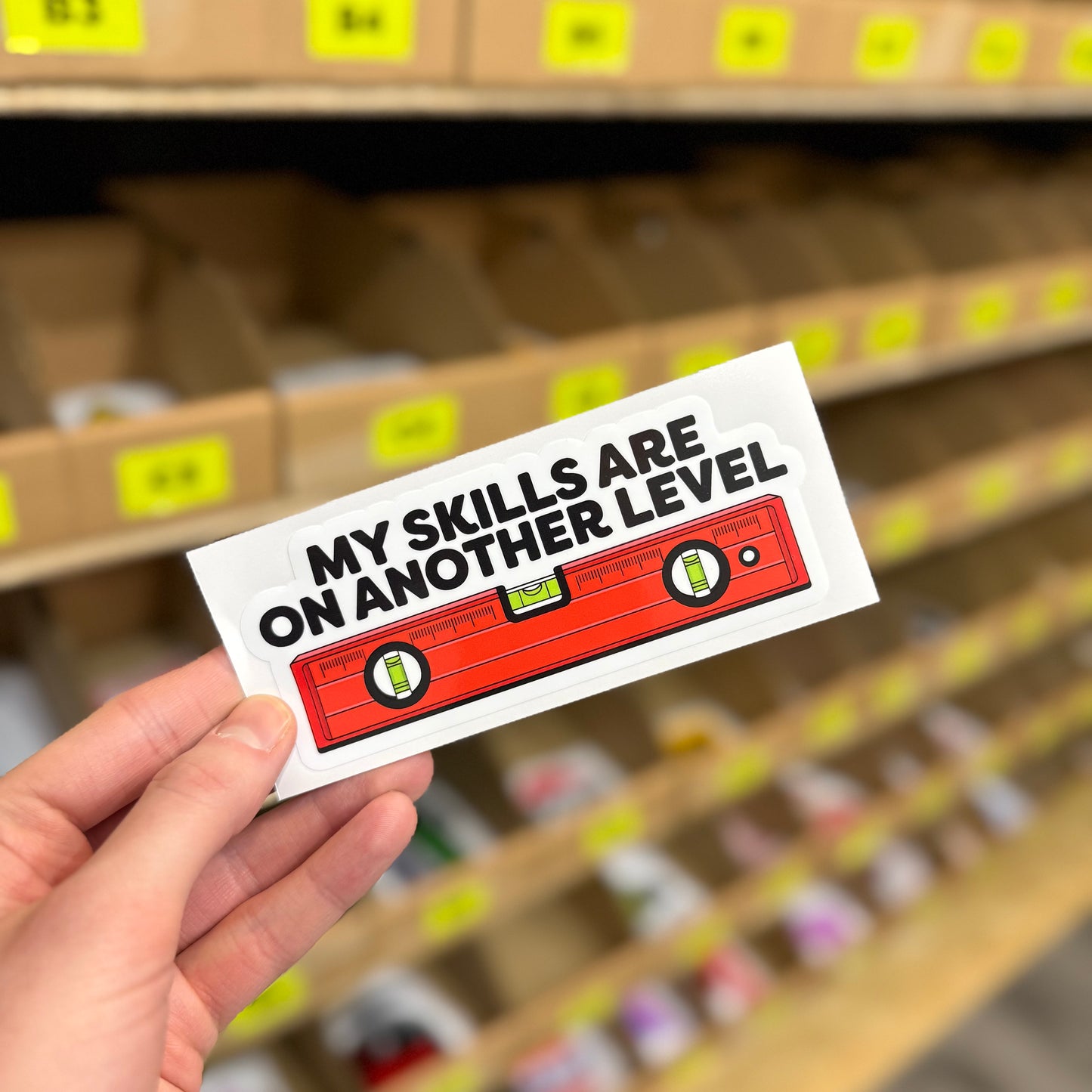Spirit level tool graphic reading “My skills are on another level” funny vinyl sticker.