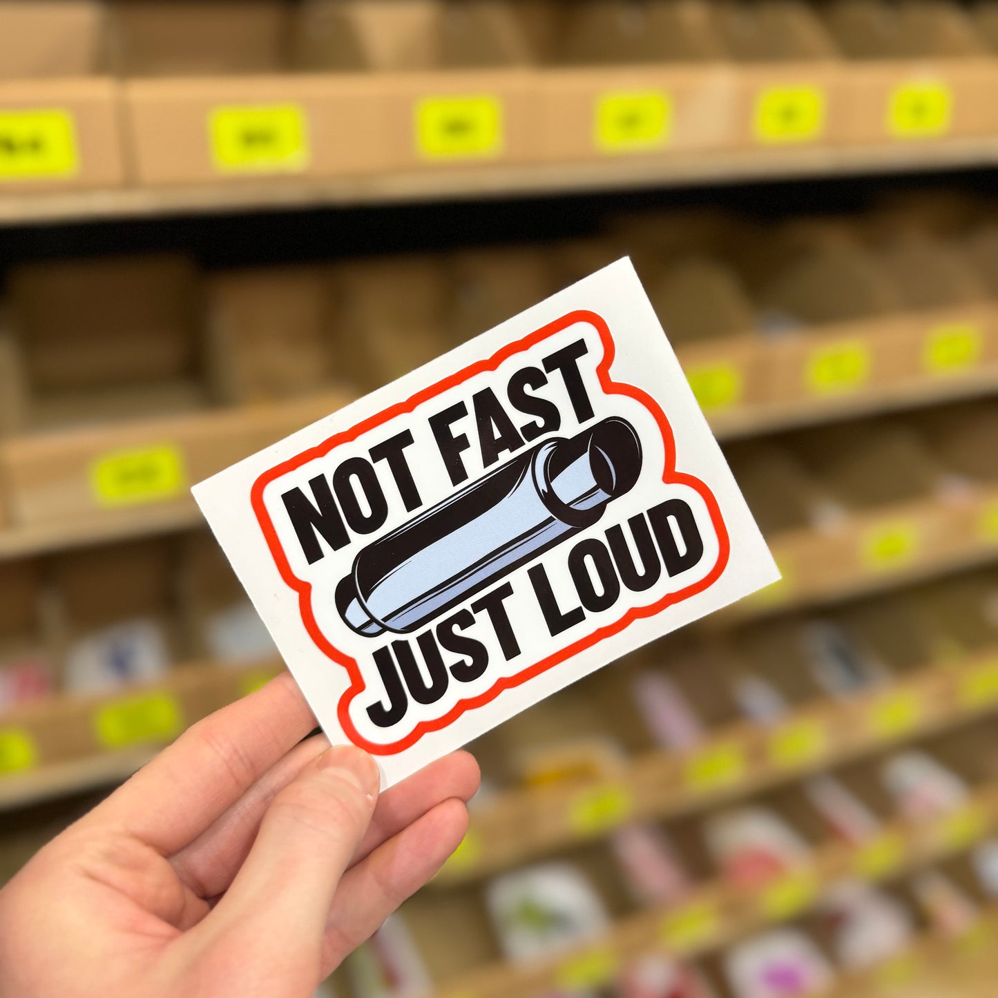 Funny car exhaust sticker reading “not fast just loud” with silencer illustration