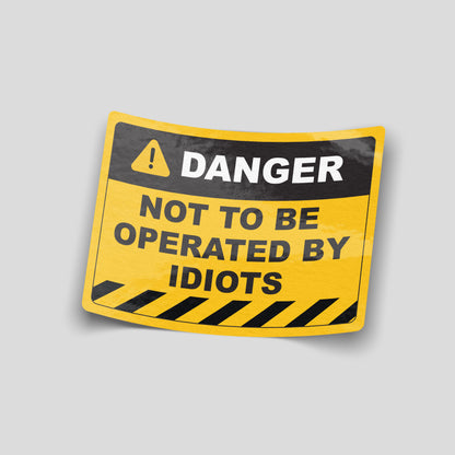 Not to be operated by idiots yellow warning sign funny car sticker, UK workshop humour vinyl by Blum Decals