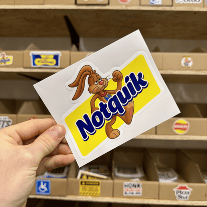 Parody yellow and blue sticker featuring a cartoon rabbit flexing next to the text ‘Notquik.