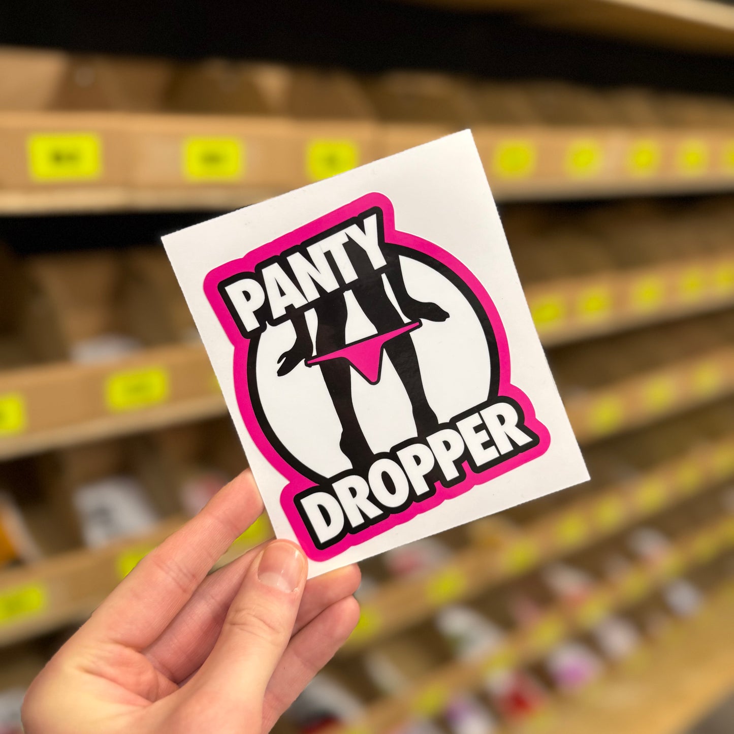 Funny rude sticker reading “panty dropper” with silhouette graphic and pink outline