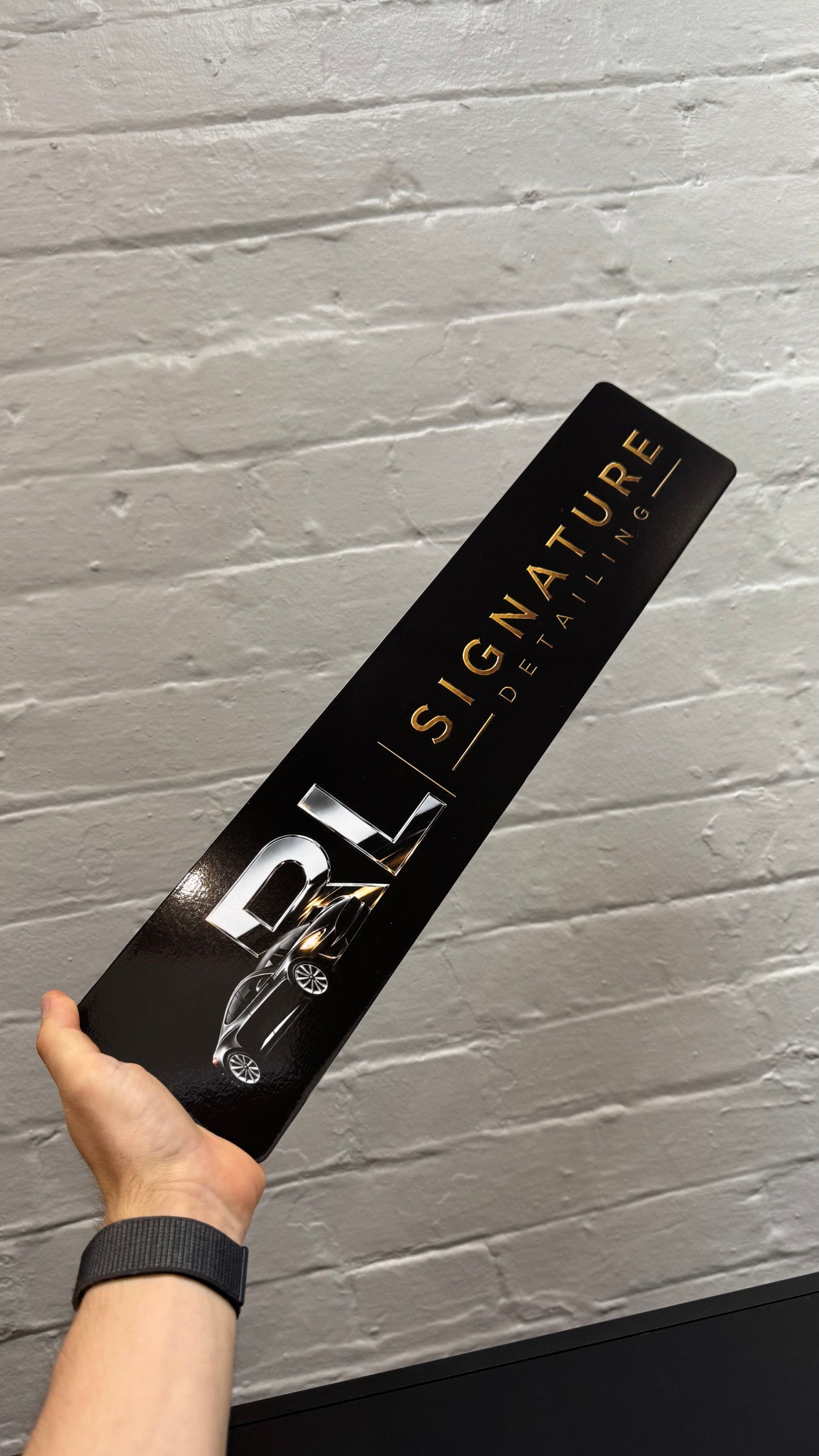 Custom black show plate featuring RL Signature Detailing branding, personalised car detailing business display plate