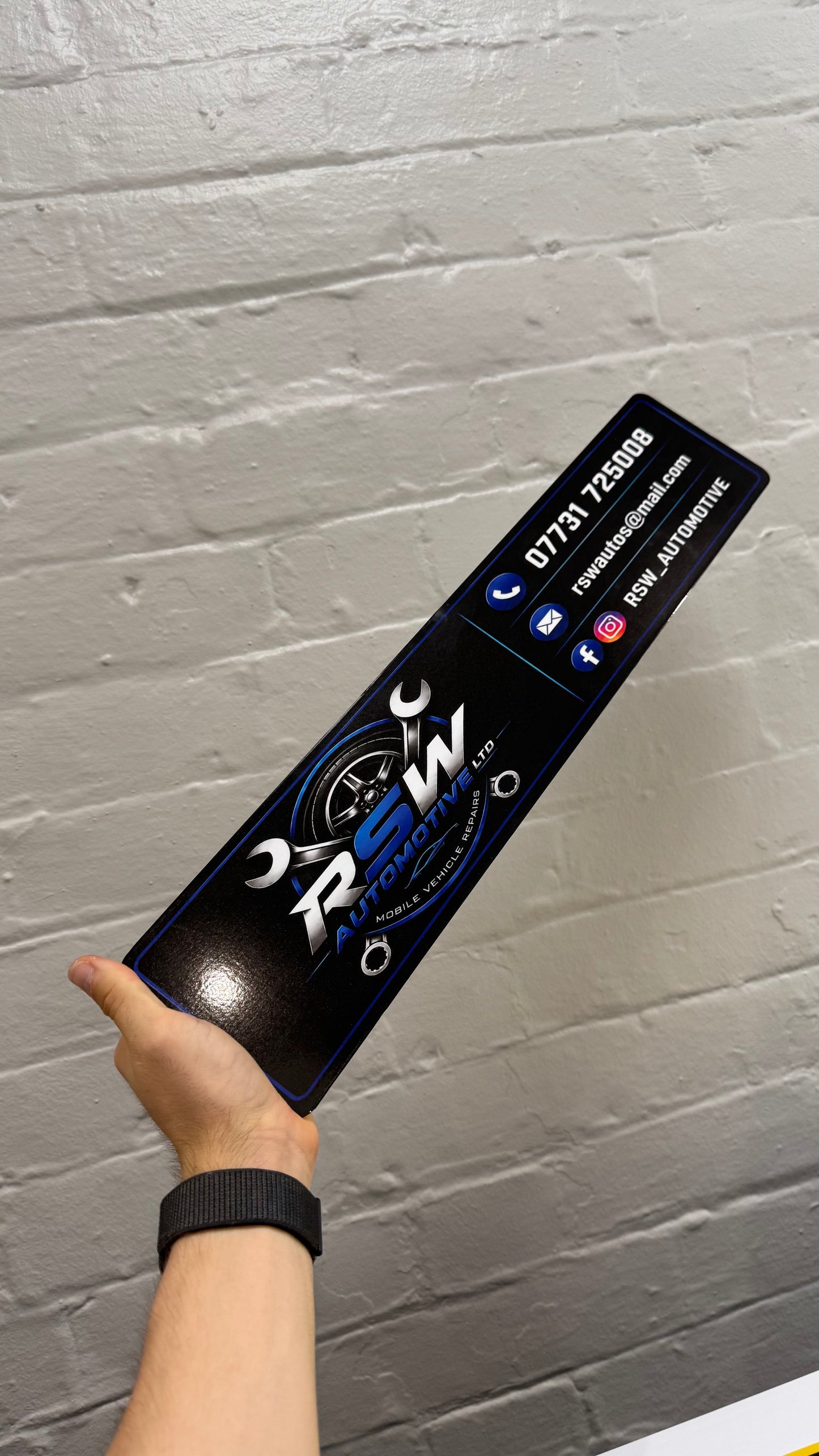 Custom automotive show plate featuring RSW Automotive business logo and contact details on a personalised car display plate
