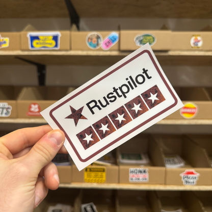 Rust-themed parody review sticker labelled ‘Rustpilot’ with a row of distressed star ratings.