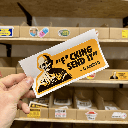 Parody sticker with an illustrated figure resembling Gandhi and the quote ‘F*cking Send It.'