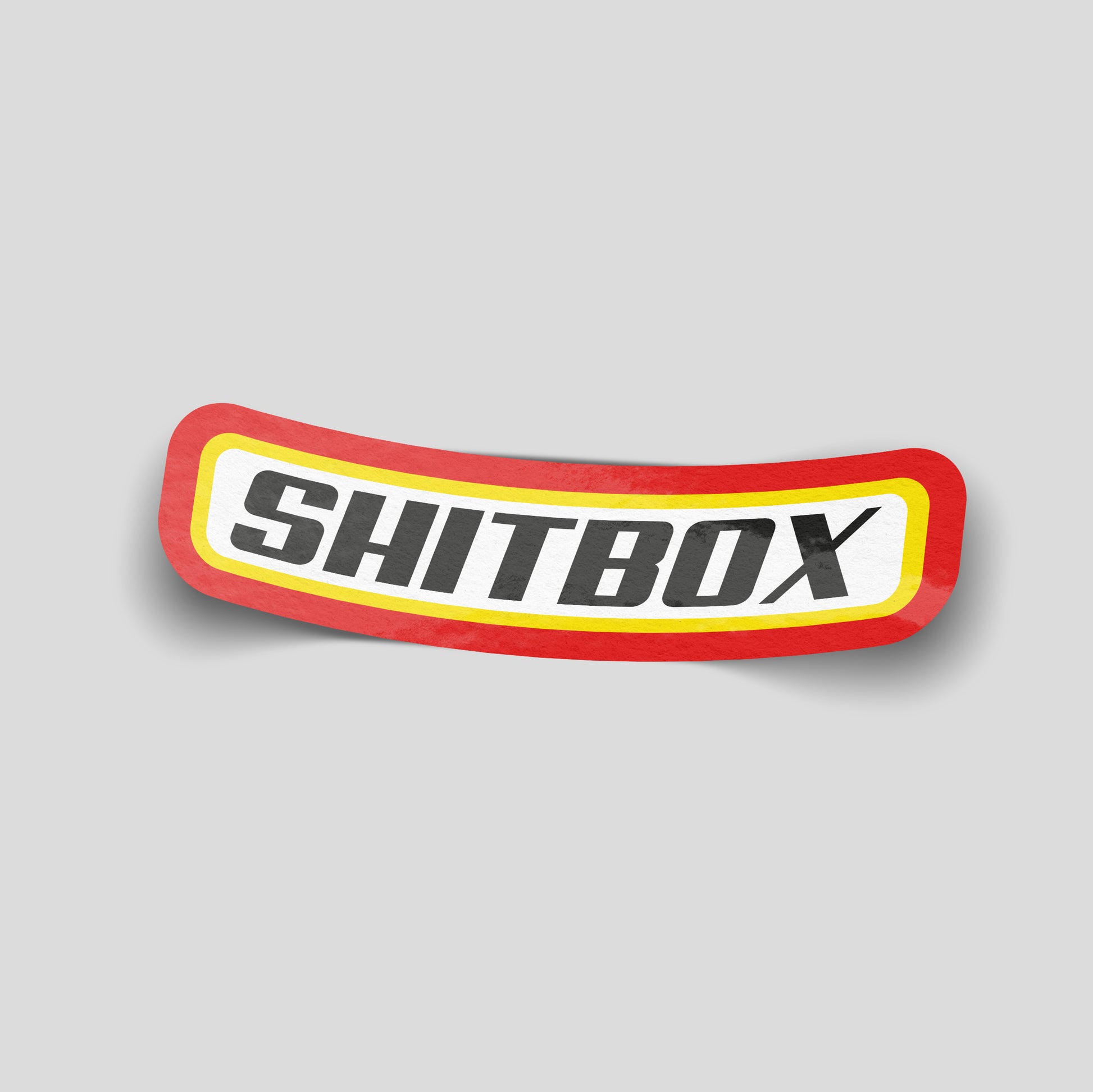 Shitbox parody badge funny car sticker with red and yellow border, UK car humour vinyl by Blum Decals