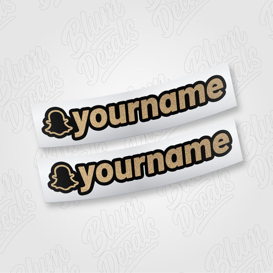 Custom Snapchat username vinyl decal in gold glitter with a black outline, shown in font 19