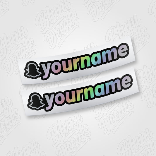 Custom Snapchat username vinyl decal in silver holographic with a black outline, shown in font 19