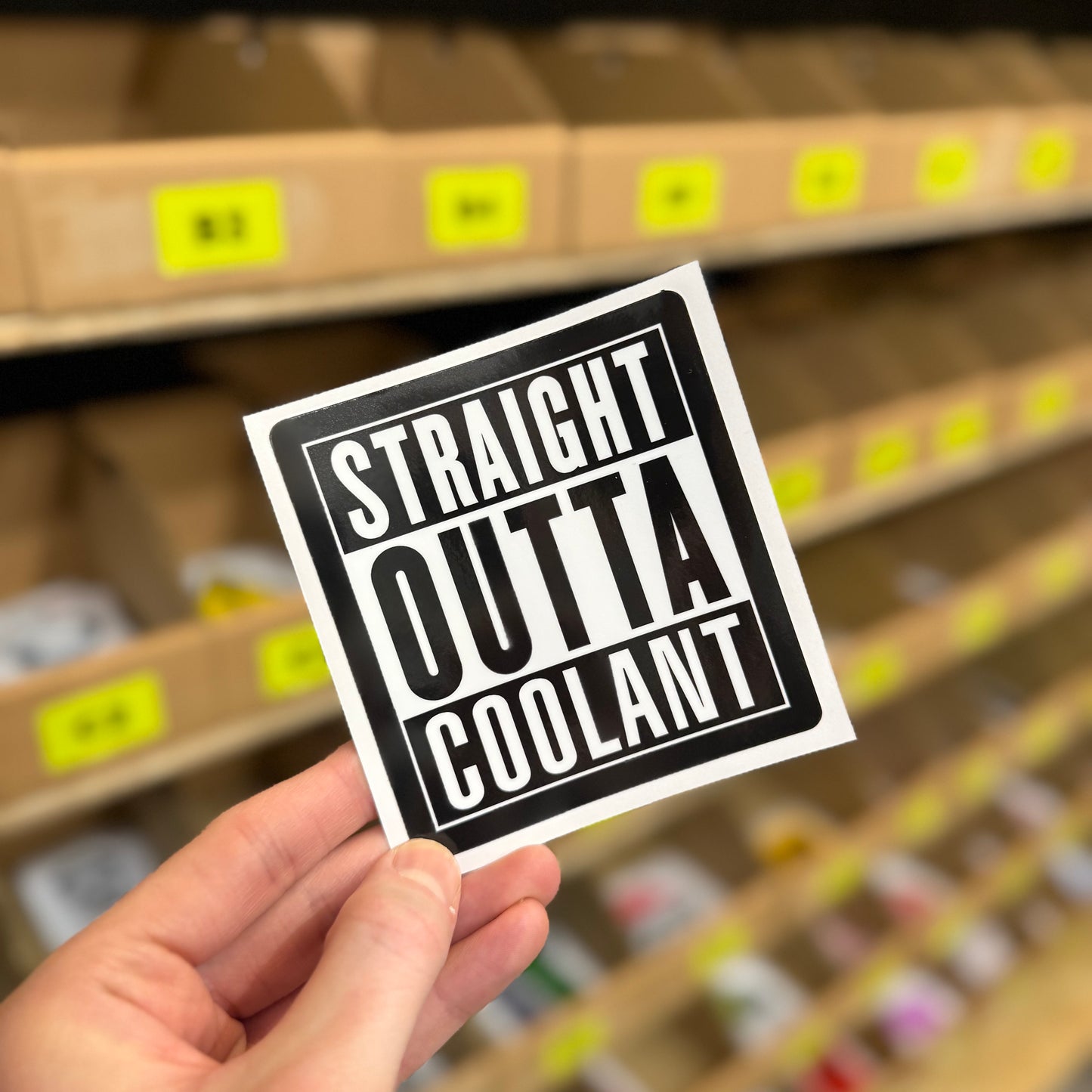 Straight outta coolant funny vinyl sticker in bold black and white typography