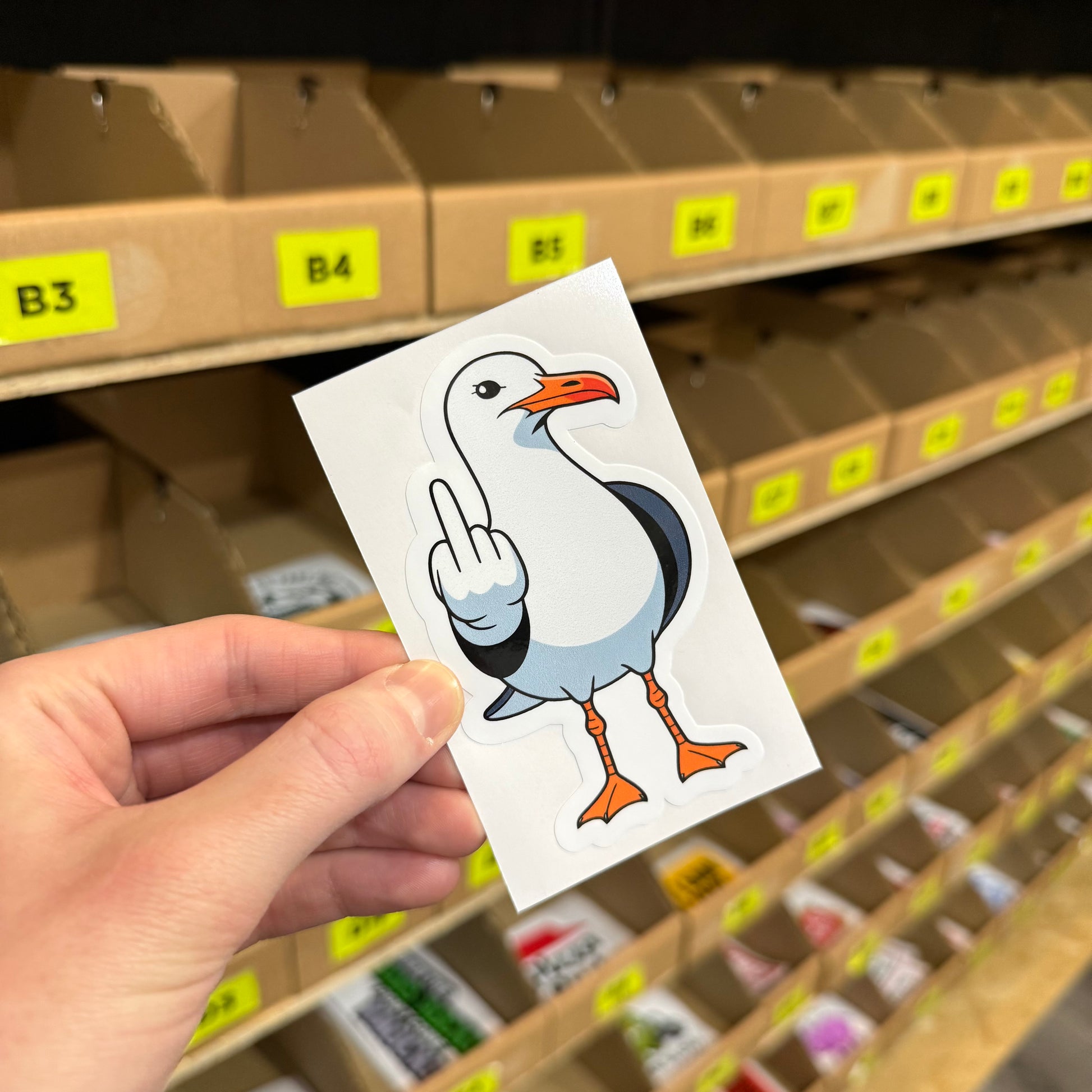 Swearing seagull funny vinyl sticker with cartoon bird showing rude gesture