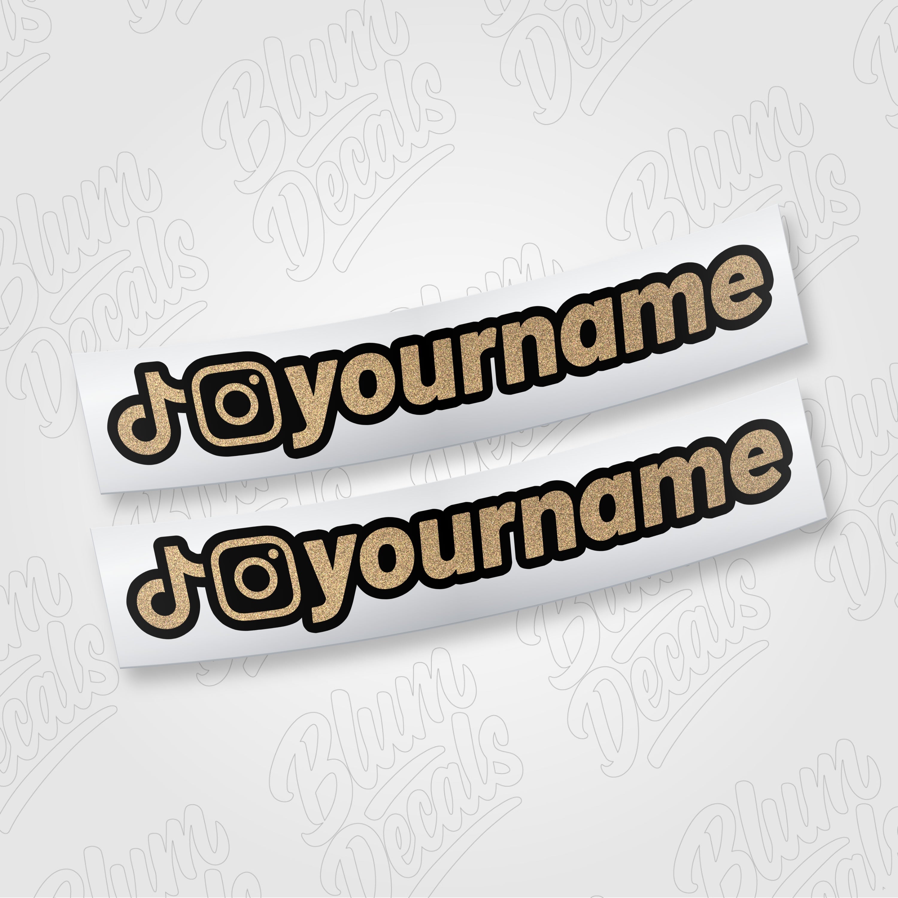 Custom TikTok and Instagram username vinyl decal in gold glitter with a black outline, shown in font 19
