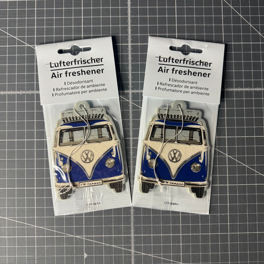 Packaged Volkswagen T1 Camper Van air freshener in fresh ocean scent. Officially licensed VW product with a retro camper van design, perfect for car interiors.