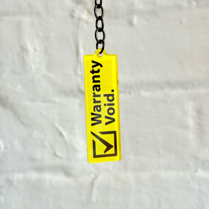 Warranty void funny acrylic keychain with yellow warning design and gloss black chain