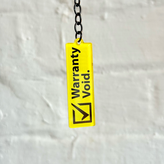 Warranty void funny acrylic keychain with yellow warning design and gloss black chain