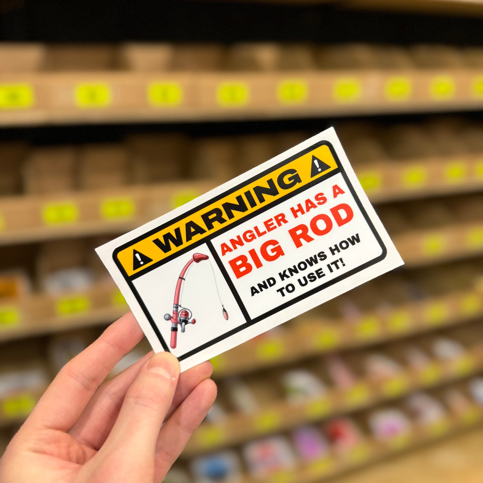 Fishing warning sign reading “Angler has a big rod” funny vinyl sticker.