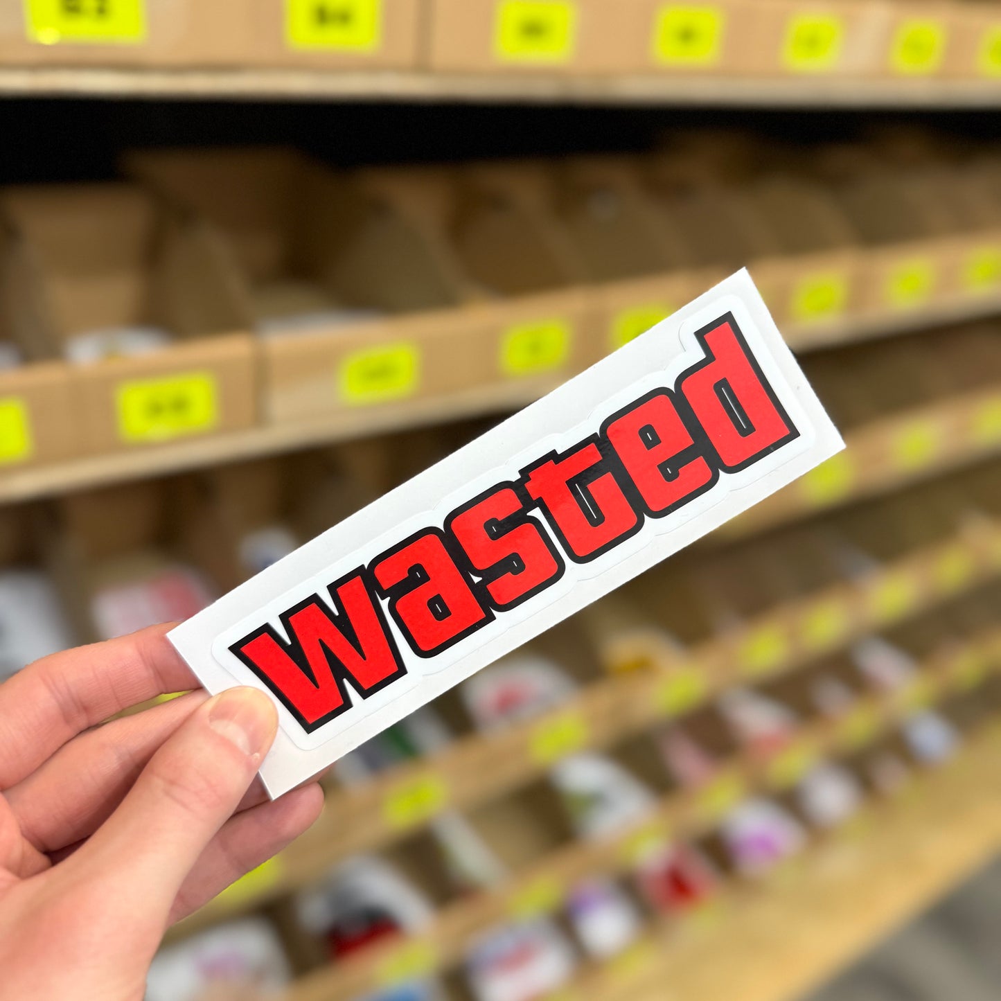 Red “Wasted” text design funny vinyl sticker.