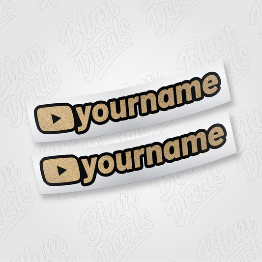 Custom YouTube channel name vinyl decal in gold glitter with a black outline, shown in font 19