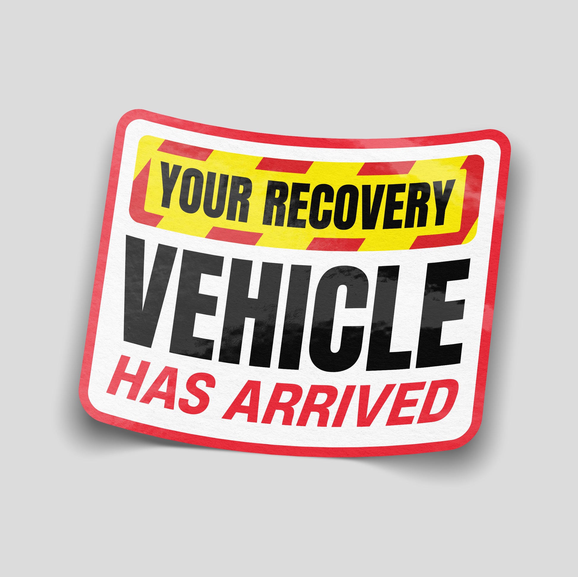 Red, yellow and black warning‑style funny car sticker reading “Your Recovery Vehicle Has Arrived”, UK towing and motoring humour decal.
