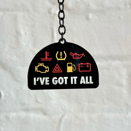 I’ve Got It All funny dashboard warning light acrylic keychain with black chain and double-sided print